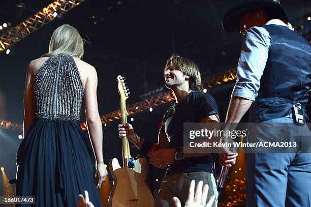 Musicians Taylor Swift, Keith Urban, and Tim McGraw perform onstage during the 48th Annual Academy of Country Music Awards at the MGM Grand Garden...