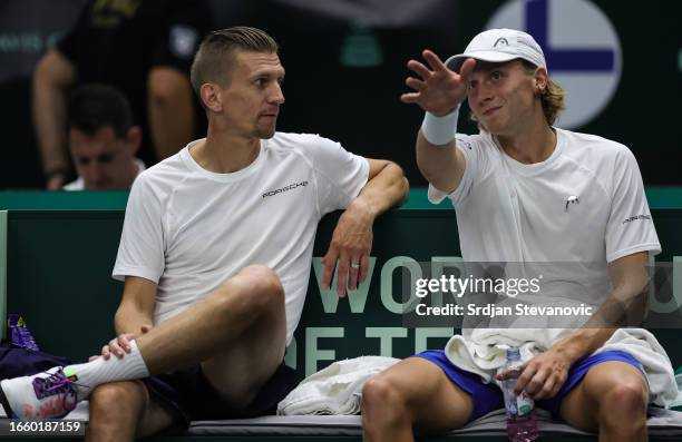 Emil Ruusuvuori speaks to captain Jarkko Nieminen of Finland preturns the ball to Tallon Griekspoor of Netherlands during the 2023 Davis Cup Finals...