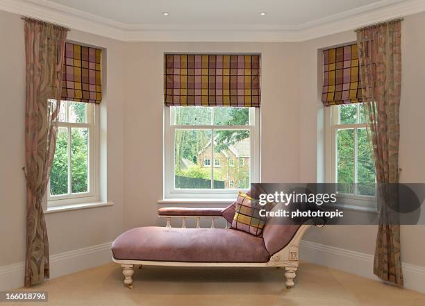 chaise longue in bay window - bay window interior stock pictures, royalty-free photos & images