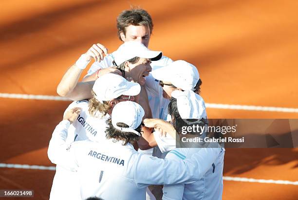 Team of Argentina celebrates after the fiveth match between Argentina and France in the queter-final round of Copa Davis at the Parque Roca Stadium...