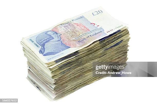 pile of twenty pound notes - british currency stockfoto's en -beelden