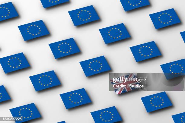 grid pattern of european flags with a single british flag - brexit stock-fotos und bilder