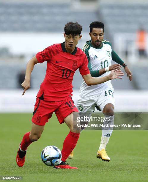 Saudi Arabia's Salem Al-Dawsari and South Korea's Jae-Sung Lee battle for the ball during the international friendly match at St. James' Park,...