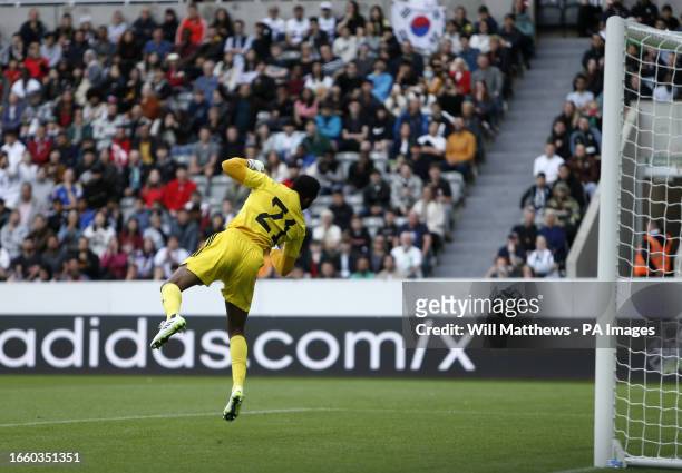 South Korea's Gue-sung Cho scores their side's first goal of the game past Saudi Arabia goalkeeper Mohammed Al-Owais during the international...