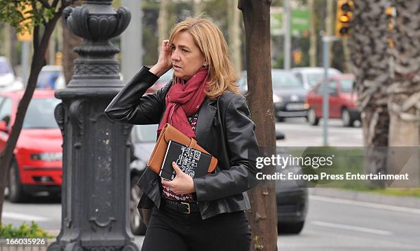 Princess Cristina of Spain walks to her office at La Caixa Foundation on April 8, 2013 in Barcelona, Spain. A Spanish court has named Princess...