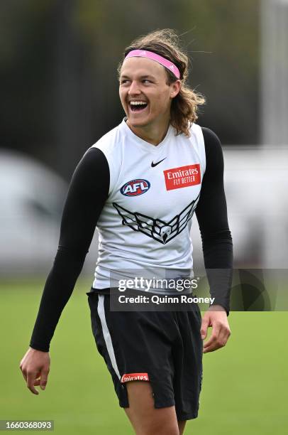 Jack Ginnivan of the Magpies has a laugh during a Collingwood Magpies AFL training session at Olympic Park Oval on September 05, 2023 in Melbourne,...