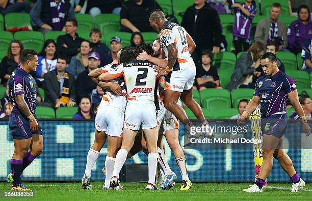 Tigers players react after Benji Marshall scored a try during the round 5 NRL match between the Melbourne Storm and the Wests Tigers at AAMI Stadium...