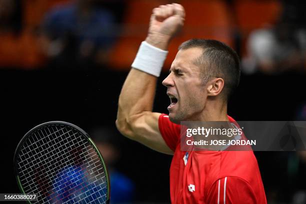 Serbia's Laslo Djere celebrates beating South Korea's Kwon Soon-woo during the group stage men's singles match between Serbia and South Korea of the...