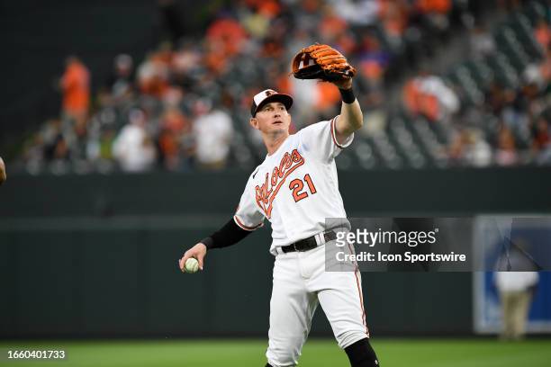 Baltimore Orioles left fielder Austin Hays tosses a ball into the stands during the Toronto Blue Jays versus Baltimore Orioles MLB game at Orioles...