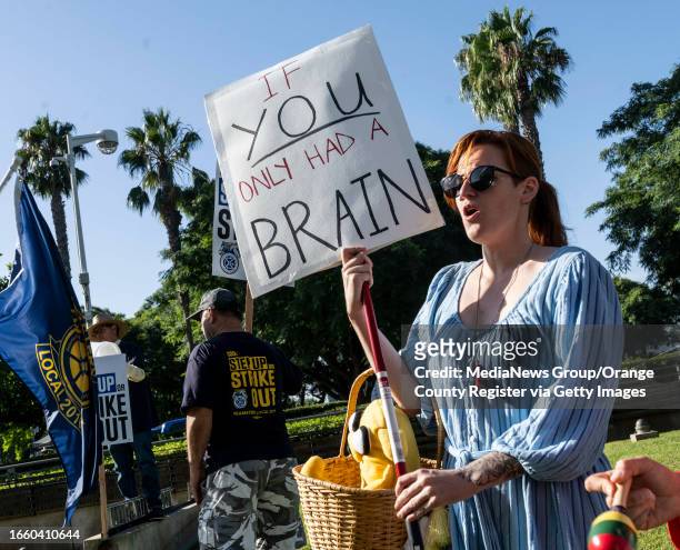 September 12: A woman dressed as Dorothy from the Wizard of Oz protests with students and union members outside the California State University...