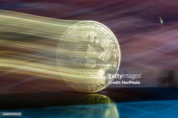 Longexposure photo illustration representing a Bitcoin coin is seen in L'Aquila, Italy, on september12th, 2023. Bitcoin is a decentralized...