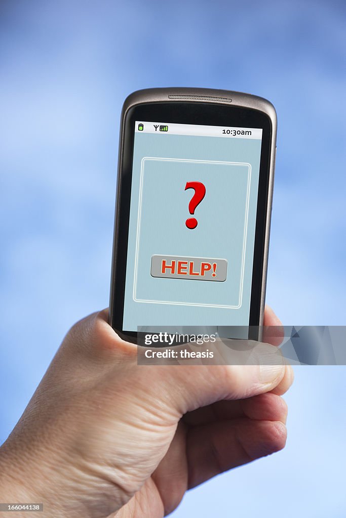 Hand holding smartphone with red question mark