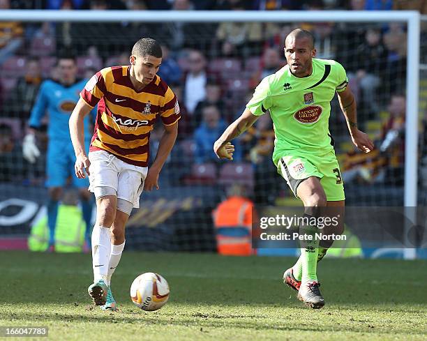 Nahki Wells of Bradford City controls the ball watched by Clarke Carlisle of Northampton Town during the npower League Two match between Bradford...