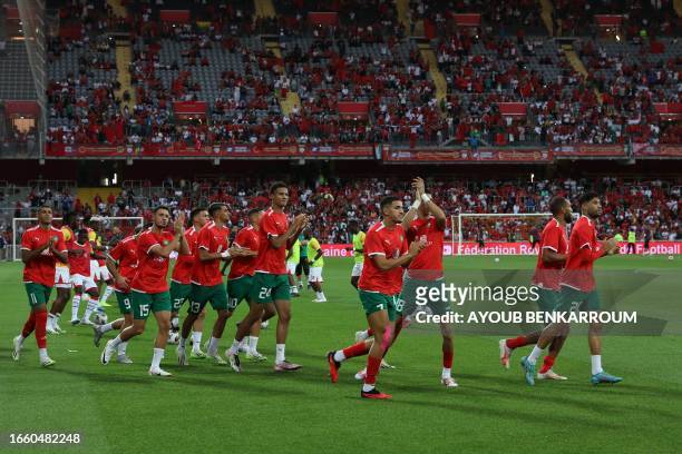 Morocco's players arrive on the field ahead of the international friendly football match between Morocco and Burkina Faso at the Stade...