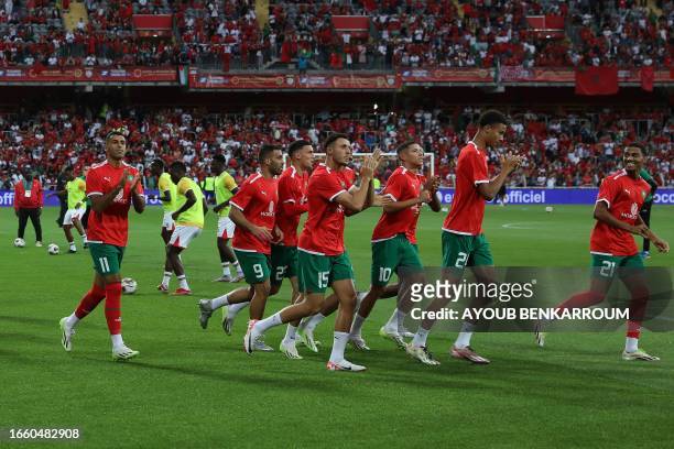 Morocco's players arrive on the field ahead of the international friendly football match between Morocco and Burkina Faso at the Stade...