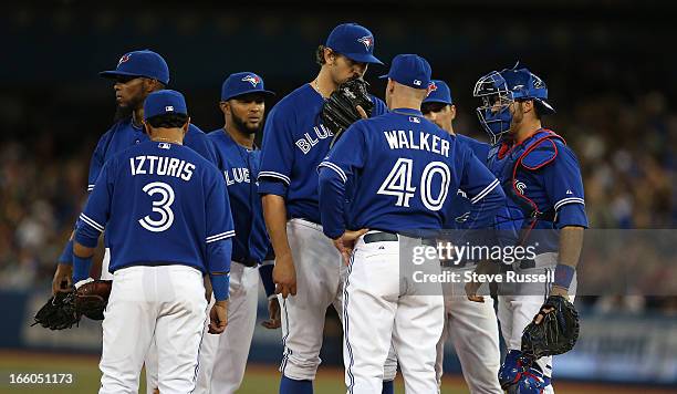 Toronto Blue Jays starting pitcher Josh Johnson draws a visit from Toronto Blue Jays pitching coach Pete Walker as the Toronto Blue Jays kick off a...