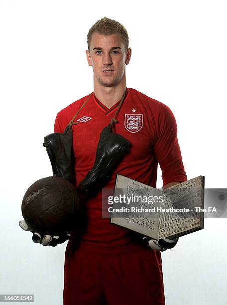 Joe Hart of Manchester City and England poses with the original FA 150 minute book and ball and boots from the era during the FA's 150th Anniversary...
