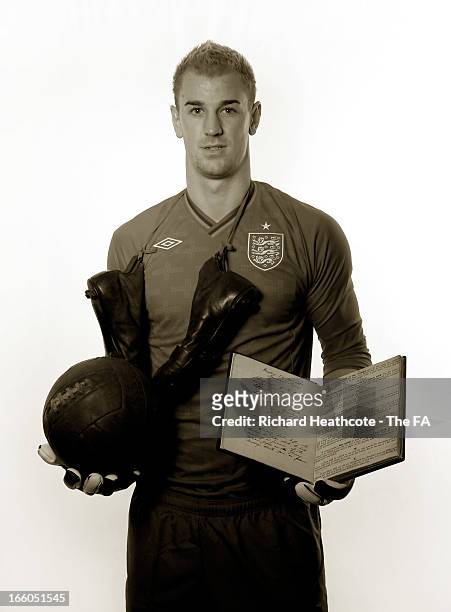 Joe Hart of Manchester City and England poses with the original FA 150 minute book and ball and boots from the era during the FA's 150th Anniversary...