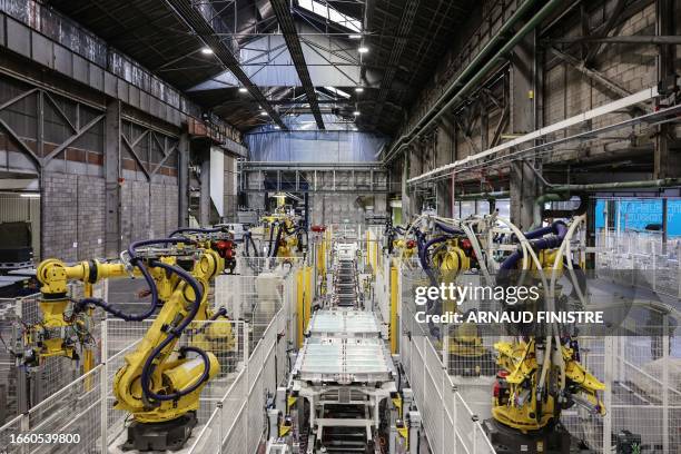 This photograph taken on September 12, 2023 shows the the production line of the new Peugeot e-3008 electric car at the Stellantis factory in...