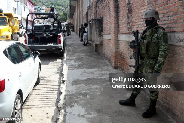 Soldier of the Mexican Army patrols near the site of the murder of Fernando Garcia Hernandez, a delegate of the Attorney General's Office in the...