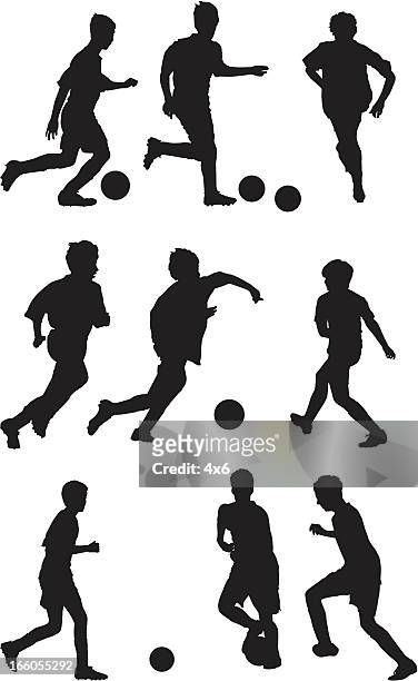 multiple silhouettes of kids playing soccer - kids soccer stock illustrations