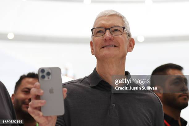 Apple CEO Tim Cook holds up a new iPhone 15 Pro during an Apple event on September 12, 2023 in Cupertino, California. Apple revealed its lineup of...