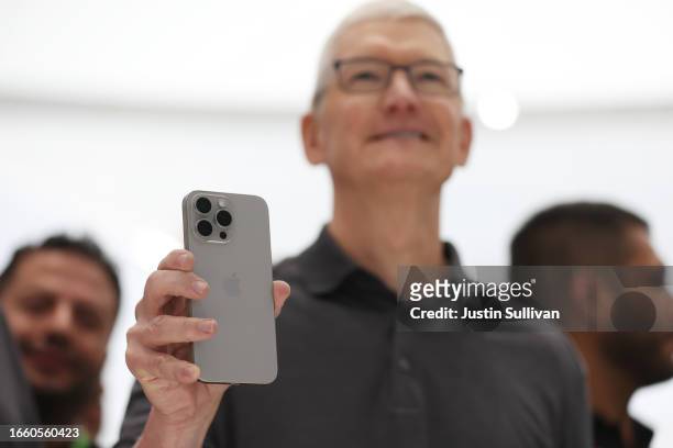Apple CEO Tim Cook holds up a new iPhone 15 Pro during an Apple event on September 12, 2023 in Cupertino, California. Apple revealed its lineup of...