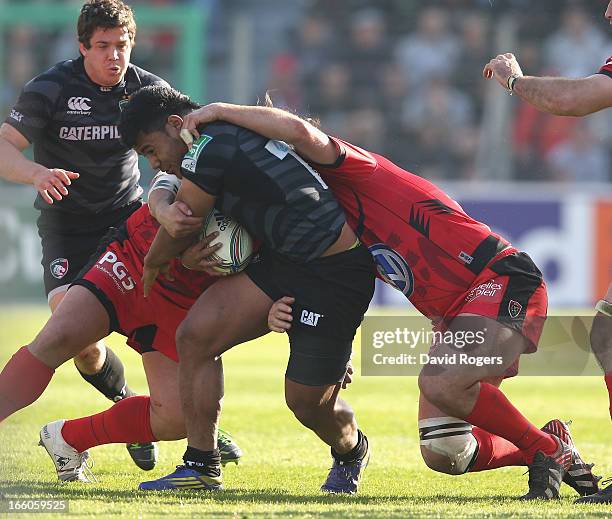 Manu Tuilagi of Leicester is tackled during the Heineken Cup quarter final match between Toulon and Leicester Tigers at Felix Mayol Stadium on April...