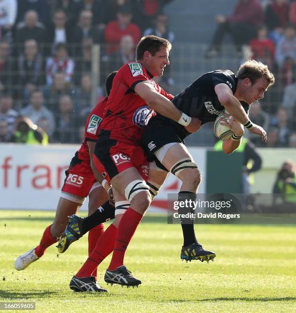 Tom Croft of Leicester is tackled by Bakkies Botha and Delon Armitage during the Heineken Cup quarter final match between Toulon and Leicester Tigers...