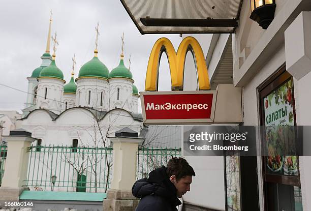 Customer orders his meal from a service window outside a McDonald's food restaurant in Moscow, Russia, on Sunday, April 7, 2013. McDonald's Corp.,...