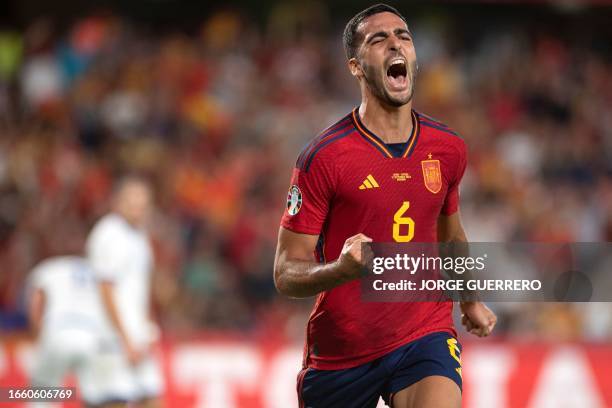 Spain's midfielder Mikel Merino celebrates scoring his team's second goal during the EURO 2024 first round group A qualifying football match between...