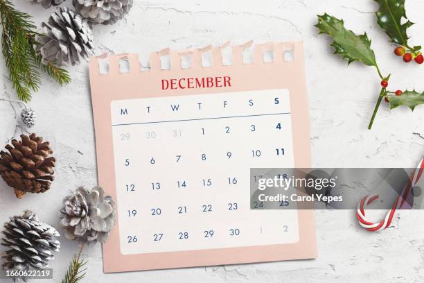 flat lay december calendar with christmas ornaments - season schedule announcement stock pictures, royalty-free photos & images