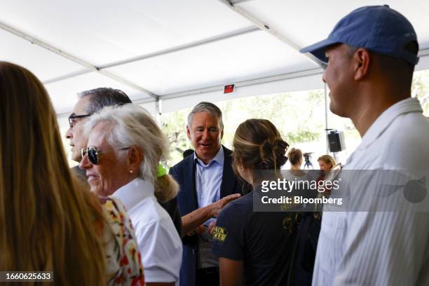 Ken Griffin, chief executive officer and founder of Citadel Advisors LLC, center, speaks with attendees during a ground breaking ceremony for the...