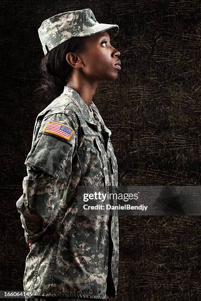 female african american soldier series: against dark brown background - troops saluting stock pictures, royalty-free photos & images