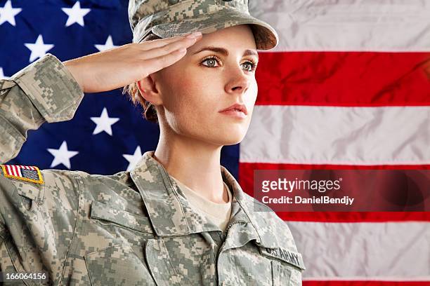 female american soldier series:against usa flag - saluting 個照片及圖片檔