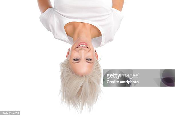 smiling woman upside down - upside down stock pictures, royalty-free photos & images