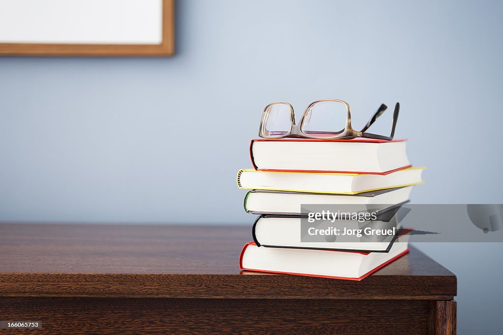 Glasses on a stack of books