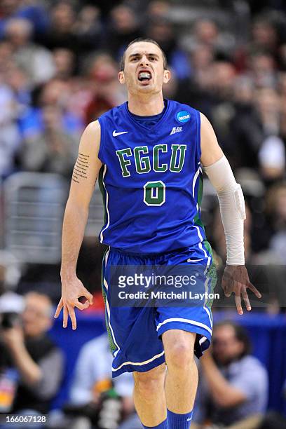 Brett Comer of the Florida Gulf Coast Eagles celebrates a shot during the second round of the 2013 NCAA Men's Basketball Tournament game against the...