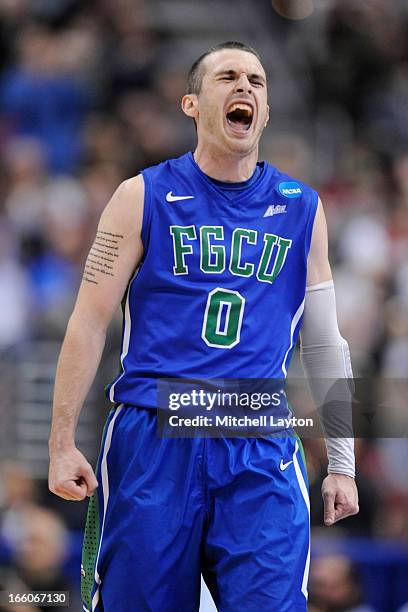 Brett Comer of the Florida Gulf Coast Eagles celebrates a shot during the second round of the 2013 NCAA Men's Basketball Tournament game against the...
