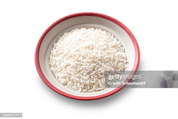 culinary essentials: white rice grains in granulated detail - cooking staples - basmati rice stock-fotos und bilder