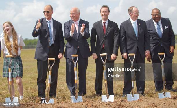 Mobile, Alabama, 8th grade student Victoria Corob, far left, European Aeronautic Defence and Space Company CEO Tom Enders, Congressman R-Alabama Jo...