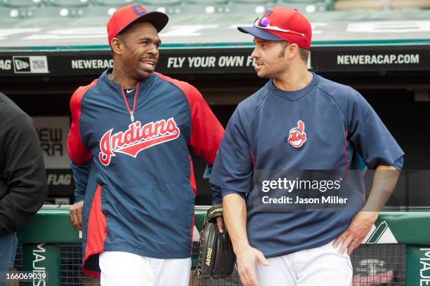 Michael Bourn and Nick Swisher of the Cleveland Indians talk prior to the start of the game against the New York Yankees on opening day at...