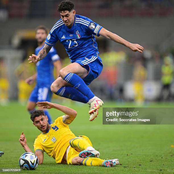 Roman Yaremchuk of Ukraine, Alessandro Bastoni of Italy during the EURO Qualifier match between Italy v Ukraine at the San Siro on September 12, 2023...