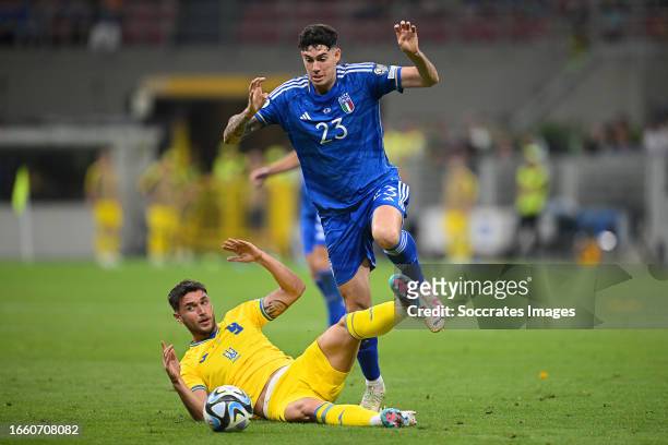 Roman Yaremchuk of Ukraine, Alessandro Bastoni of Italy during the EURO Qualifier match between Italy v Ukraine at the San Siro on September 12, 2023...