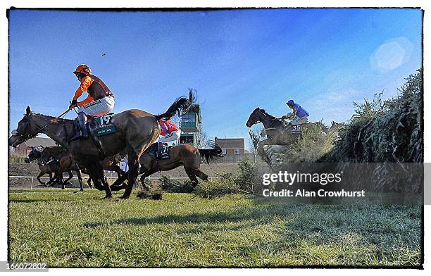 Ryan Mania riding Auroras Encore clear the 19th fence on their way to winning The John Smith's Grand National Steeple Chase at Aintree racecourse on...