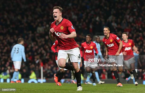 Phil Jones of Manchester United celebrates scoring their first goal during the Barclays Premier League match between Manchester United and Manchester...