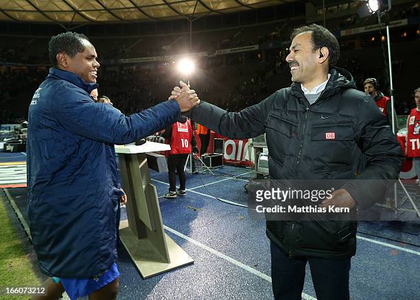Head coach Jos Luhukay of Berlin and Ronny show their delight after winning the Second Bundesliga match between Hertha BSC Berlin and Eintracht...
