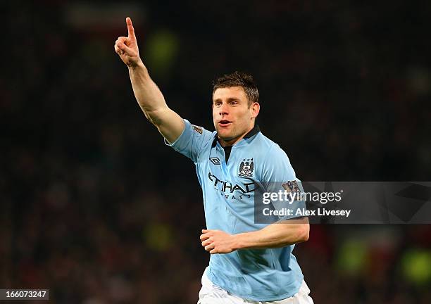 James Milner of Manchester City celebrates scoring the opening goal during the Barclays Premier League match between Manchester United and Manchester...