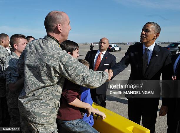 President Barack Obama greets well-wishers upon his arrival at Bradley Air National Guard Base in Hartford, Connecticut on April 8, 2013. Obama is in...