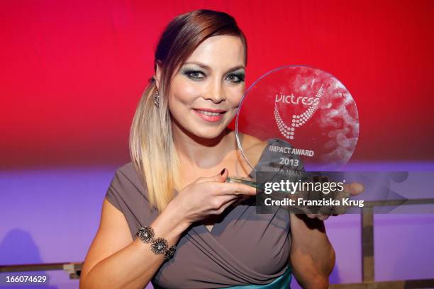 Regina Halmich receives an award at the Victress Day Gala 2013 at the MOA Hotel on April 8, 2013 in Berlin, Germany.